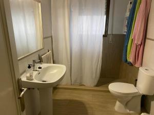 a bathroom with a sink and a toilet and a shower at Mi Descanso in Córdoba +24 photos