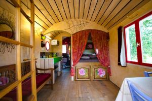 an inside view of a room in a tiny house at Ecrin du Ségala - Roulotte insolite in Tauriac-de-Naucelle