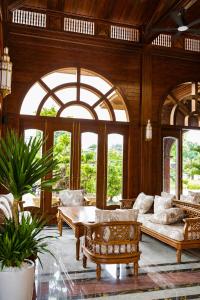 a living room with a couch and a table at Le' VIVA Resort Mui Ne in Mui Ne