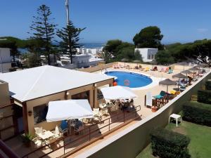 a view of a resort with a swimming pool at Marta Beach House - Caños De Meca in Los Caños de Meca