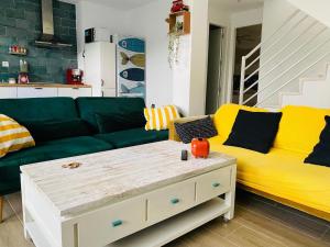 a living room with a couch and a table at Marta Beach House - Caños De Meca in Los Caños de Meca +26 photos