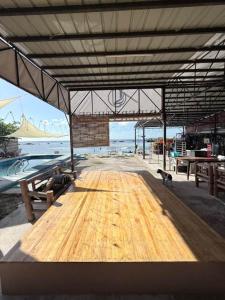 a wooden table with two cats sitting on top of it at Under the sea diving resort in Lapu Lapu City