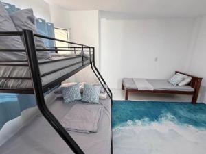 a bedroom with a bunk bed and a bunk bed at Under the sea diving resort in Lapu Lapu City