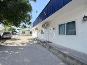 a white building with a car parked next to it at Under the sea diving resort in Lapu Lapu City +4 photos