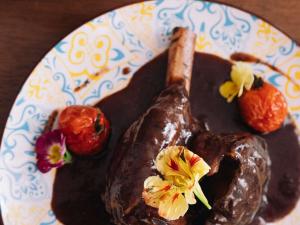a plate of food with chocolate and strawberries on it at ibis Styles Pont du Gard Route d'Avignon in Estézargues