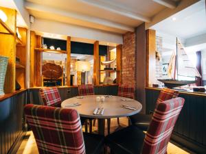 a dining room with a table and chairs at ibis Coleraine Riverside in Coleraine