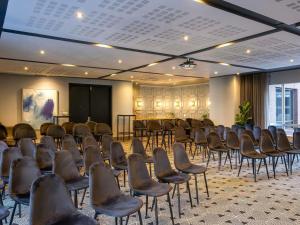 a room with a bunch of chairs in it at Pullman Cape Town City Centre in Cape Town +86 photos