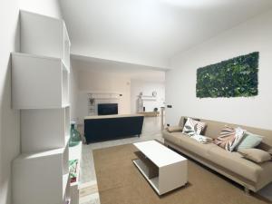a living room with a couch and a table at Unit 120 in SantʼAgata di Militello