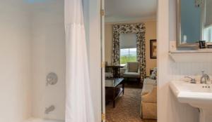 a bathroom with a sink and a toilet in a room at Mountain View Grand Resort & Spa in Whitefield +97 photos