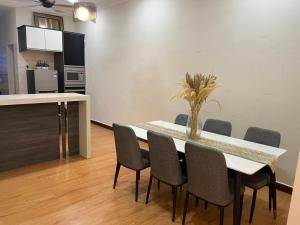 a dining room with a table and chairs at Suzys homestay in Kuantan