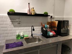 a kitchen counter top with a sink and a sink at 910 Entire Homestay Seremban Town, Templer, Lobak, Lekas Highway in Seremban