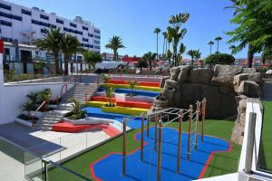 a water park with a slide and a roller coaster at Sholeo Lodges Maspalomas in Playa del Ingles +179 photos