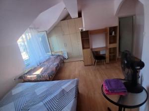 a small living room with a couch and a table at Tiha noc apartmani in Belgrade