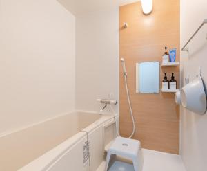 a bathroom with a white toilet and a sink at fleuve tenmonkan in Yamashitachō +88 photos