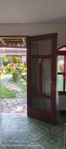 an open door to a room with a yard at Hotel Playa Santa Martha in Rivas