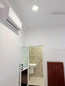 a bathroom with a toilet and a sink and a shower at Sunny's Hide Out in Talalla South +64 photos