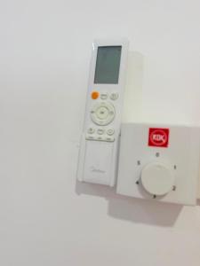 a nintendo wii remote control sitting on a wall at Sunny's Hide Out in Talalla South