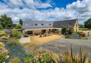 an aerial view of a house with a garden at Gîte Le petit Fresnay in Le Bourgneuf-la-Forêt
