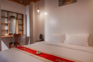 Postel nebo postele na pokoji v ubytování BB Angkor Residence
