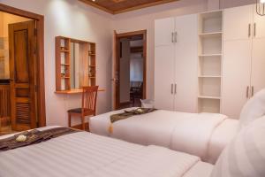 Postel nebo postele na pokoji v ubytování BB Angkor Residence
