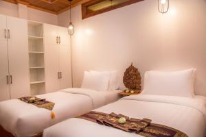 Postel nebo postele na pokoji v ubytování BB Angkor Residence