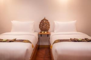 Postel nebo postele na pokoji v ubytování BB Angkor Residence
