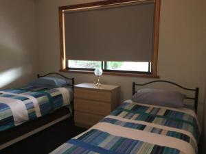 Postel nebo postele na pokoji v ubytování Hamilton + 9 fotografií