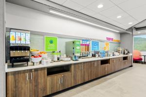 a kitchen with a counter with food on it at Tru By Hilton Princeton in Princeton