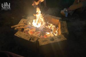 a fire is burning in a brick oven at Cabañas Alpinas en Oxapampa in Oxapampa