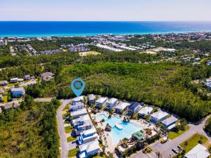 an aerial view of a resort with a pool and the ocean at Easy Breezy in Santa Rosa Beach