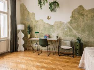 a room with a table and two chairs at City Center Boutique Apartments - Schlossberg View - Free Parking in Graz