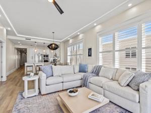 a living room with a couch and a table at Adagio #401B in Santa Rosa Beach