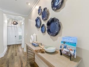 a room with blue plates on the wall at Adagio #401B in Santa Rosa Beach +36 photos