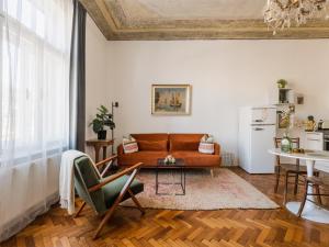 a living room with a couch and a table at City Center Boutique Apartments - Schlossberg View - Free Parking in Graz +57 photos