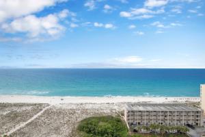 a view of the beach from the balcony of a building at Emerald Dolphin #1610 in Pensacola Beach
