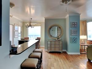 a living room with a counter and a mirror at Beach Colony East #15A in Perdido Key