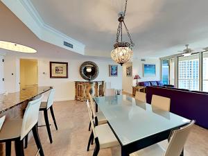 a dining room with a table and chairs at Portofino Island Resort #2-1608 in Pensacola Beach