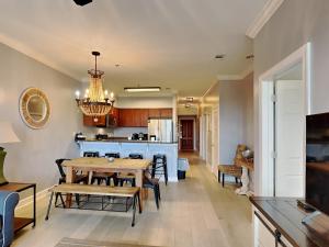 a dining room and kitchen with a table and chairs at Village Of South Walton #263A in Rosemary Beach