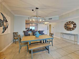 a dining room with a table and chairs at Portofino Island Resort #1-702 in Pensacola Beach