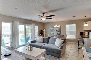 a living room with a couch and a table at Gulf Island #621 in Navarre