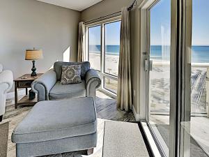 a living room with a view of the ocean at Emerald Isle #405 in Pensacola Beach