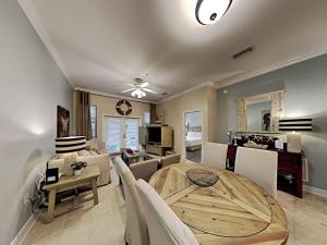 a dining room and living room with a table at Seagrove Highlands #2104 in Santa Rosa Beach