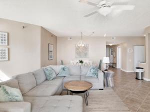 a living room with a couch and a table at Beach Colony Towers #15C in Perdido Key