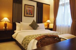 Postel nebo postele na pokoji v ubytování Yulia Village Inn Ubud