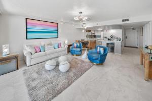 a living room with a couch and chairs and a table at One Seagrove Place #1308 - "Love at First Sight" in Santa Rosa Beach