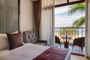 Kama o mga kama sa kuwarto sa Jie Jie Beach Hotel
