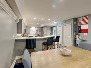 a kitchen and dining room with a table and chairs at Aegean 327 in Destin +33 photos