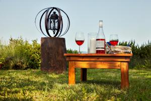 a table with wine glasses and wine bottles on it at Tenuta il Poggetto in Radda in Chianti