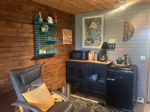 a room with a desk and a chair in a room at River view contryside in Reykholt
