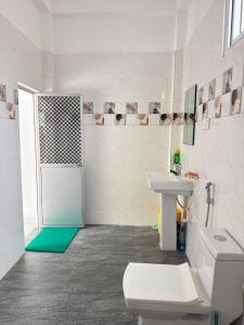 a bathroom with a toilet and a sink at Blue Wave Holiday Villa in Weligama +25 photos